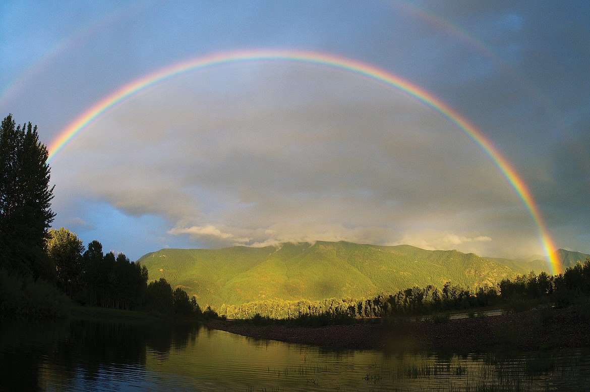 A rainbow arches over Columbia Mountain in this file photo.