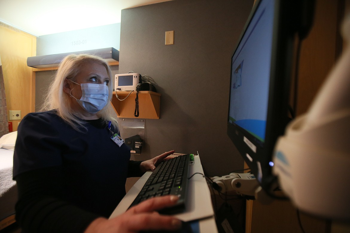 Kootenai Health registered nurse Donnie uses a computer in a patient room Wednesday in the Adult Recovery Unit in a quiet wing of the hospital. Kootenai Health offers medically supervised detox services for those seeking to rid themselves of addiction. The program accepts Medicaid and insurance.