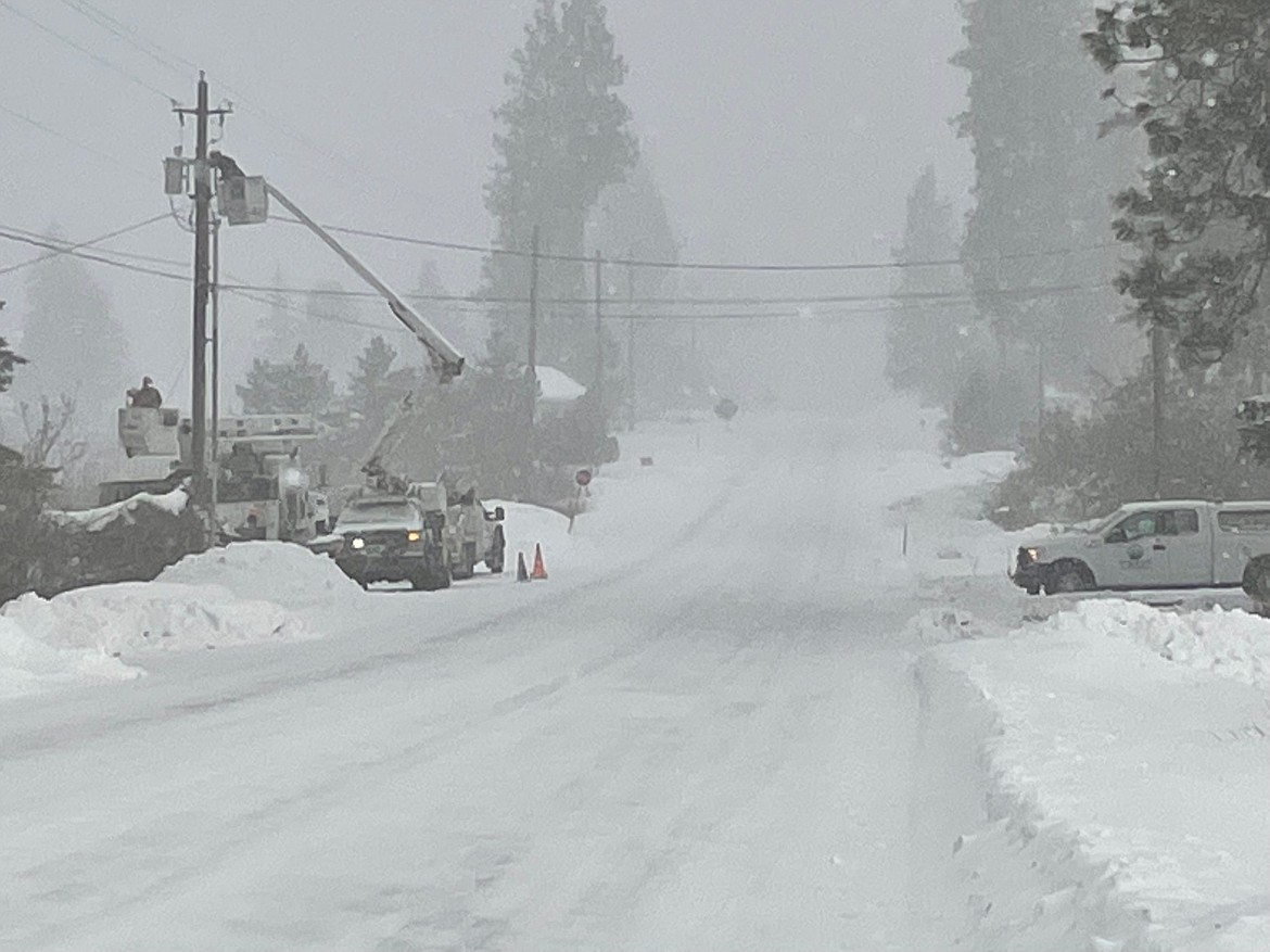 Flathead Electric Cooperative linemen at work on Thursday, Dec. 22. (Flathead Electric Cooperative photo)