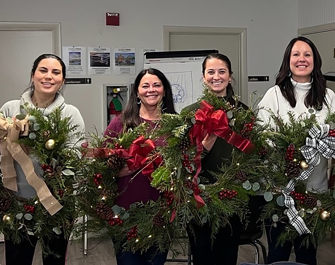 POAC adult art class students display thir finished products at the end of the Holiday Wreath Class. Pictured from left, Mariela Rebelo, Sheryl Rickard, Molly Behrens, and Erin Binnall. New classes start in January. More info and registration at www.artinsandpoint.org.