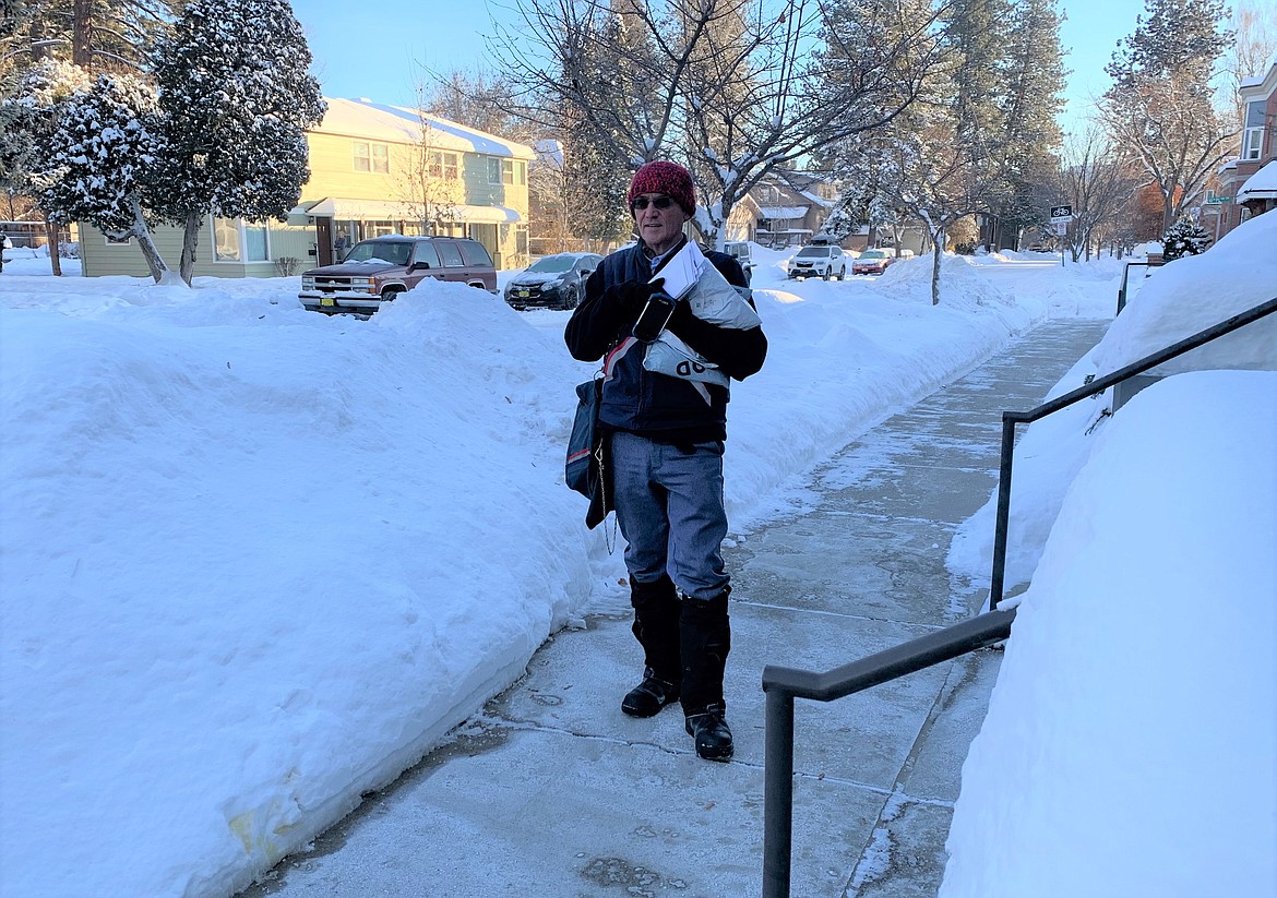 Randal Swisher delivers mail in Coeur d'Alene on Thursday morning.