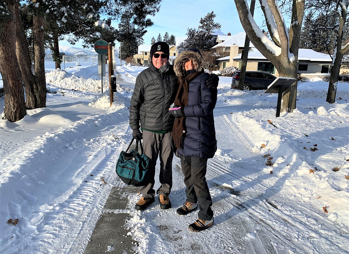 Ken and Janice Copper stop during their walk home through City Park on Thursday morning.