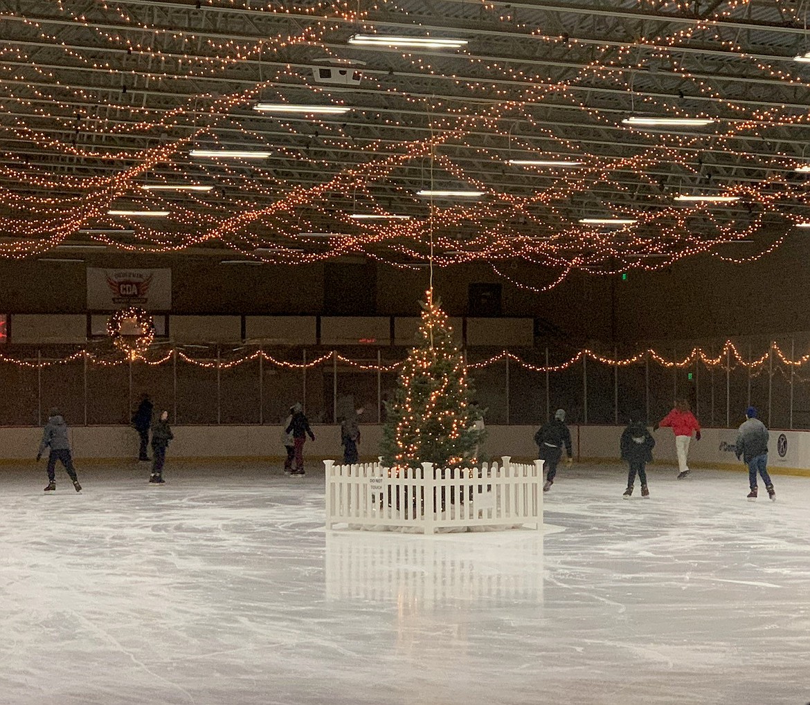 Holiday skaters take in the lights, music, and tree at Frontier Ice Arena in Coeur d'Alene during their '12 Skates of Christmas' event.