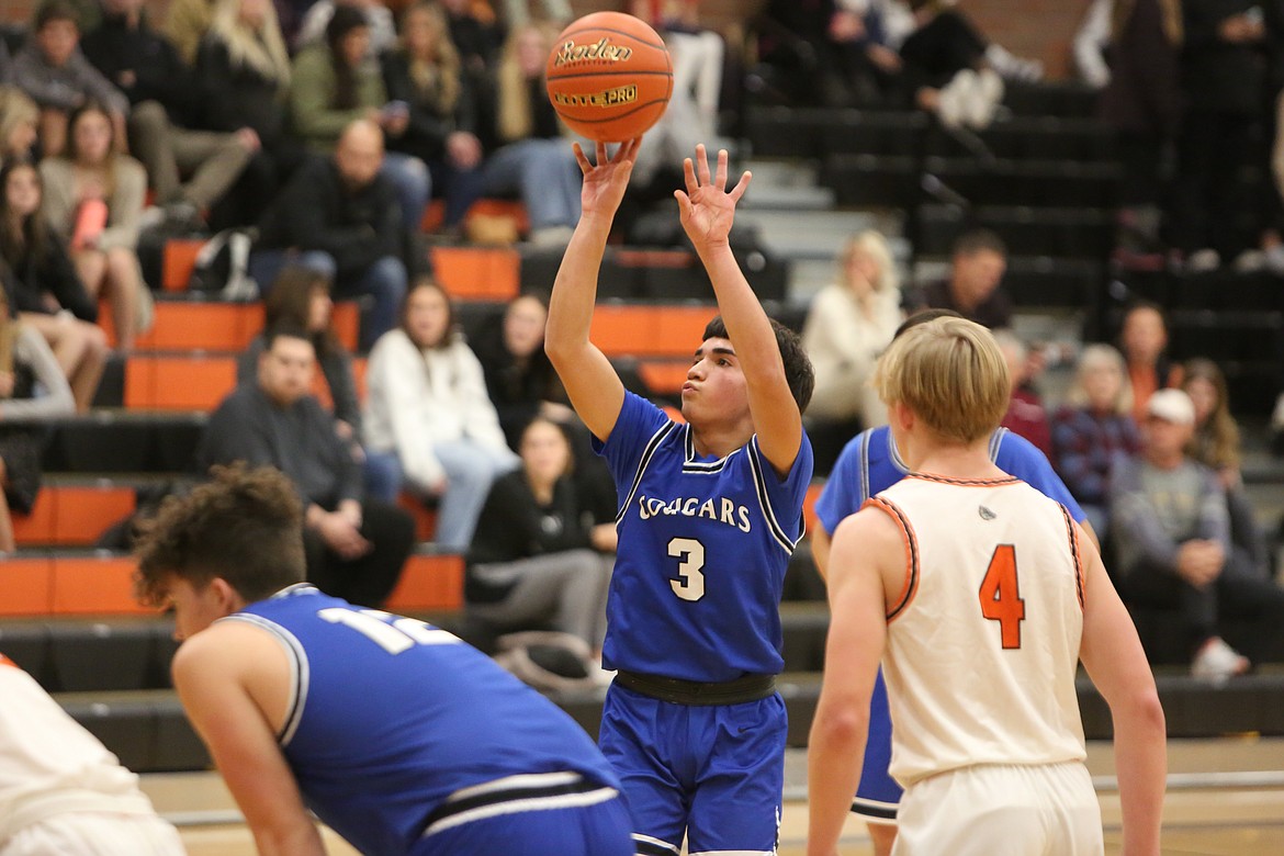 Anthony Gotierrez (3) takes aim at the hoop for a free throw. Gutierrez was named Athlete of the Week last week for his performance on the court.