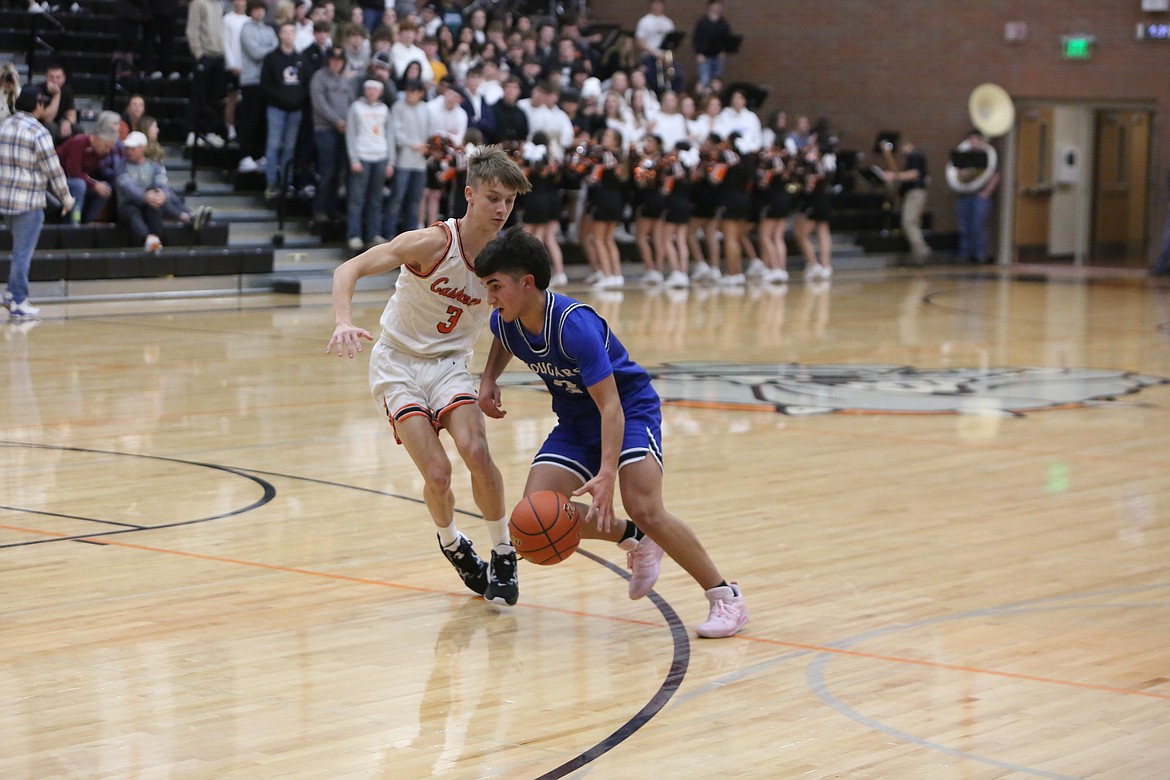 Anthony Gutierrez drives toward the basket against Cashmere, bypassing a Bulldog defender.