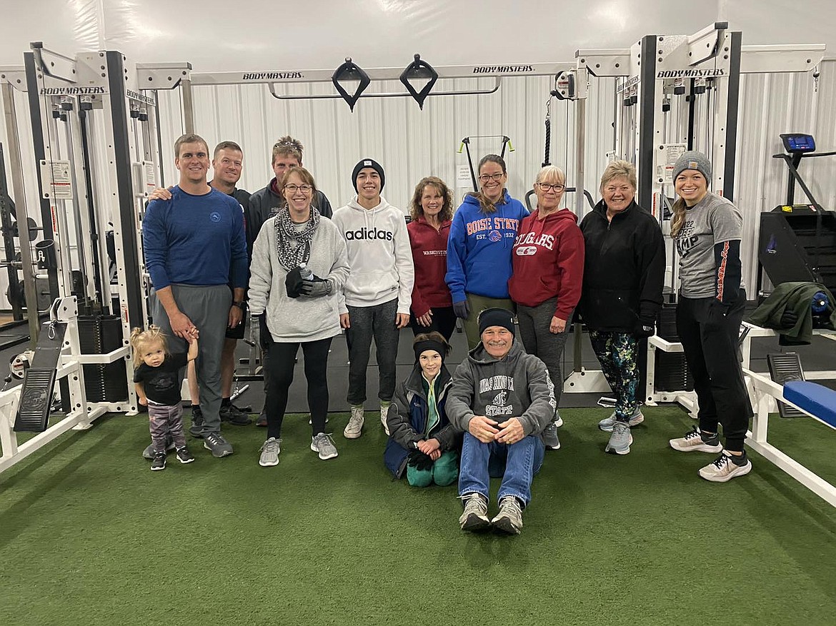 Members at The Grind Gym pose for a photo during the gym’s Turkey Trot run in November 2022.