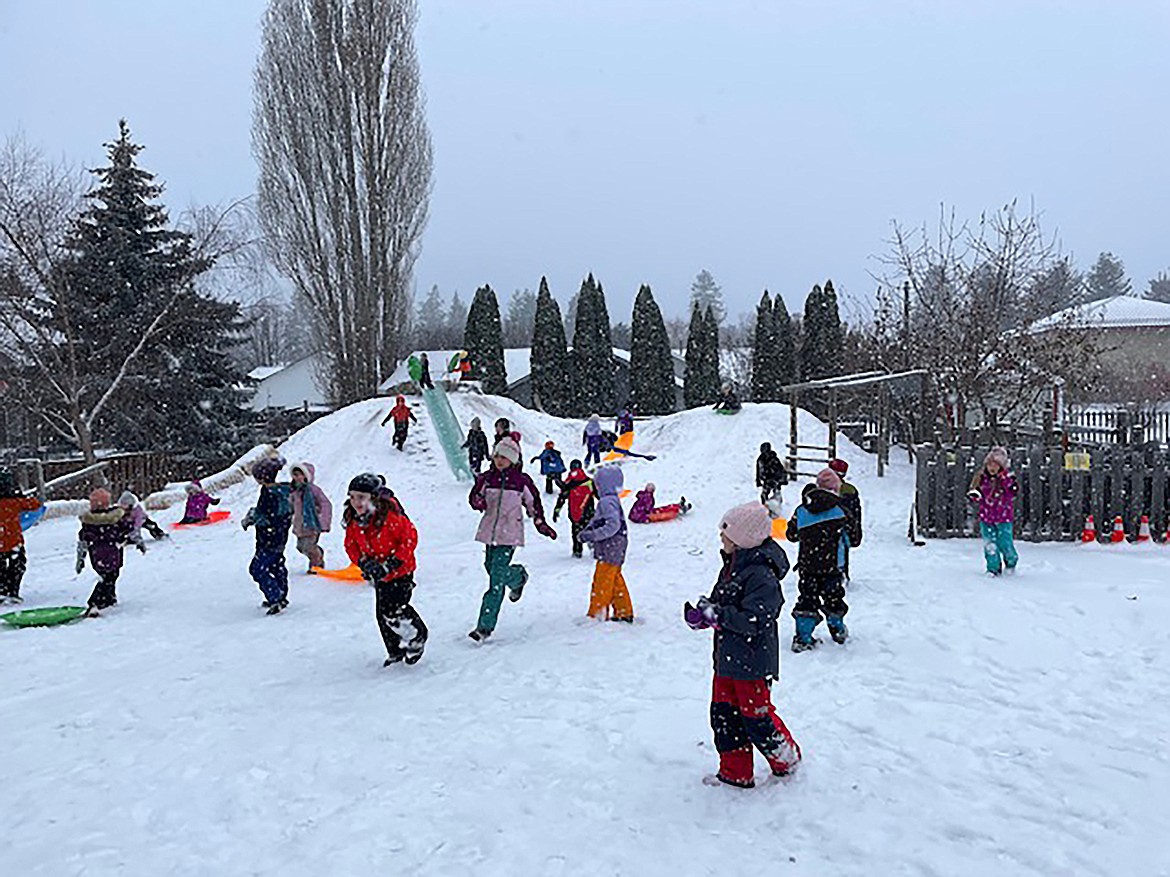 Sandpoint Waldorf students laugh and play in the snow during a recent recess.