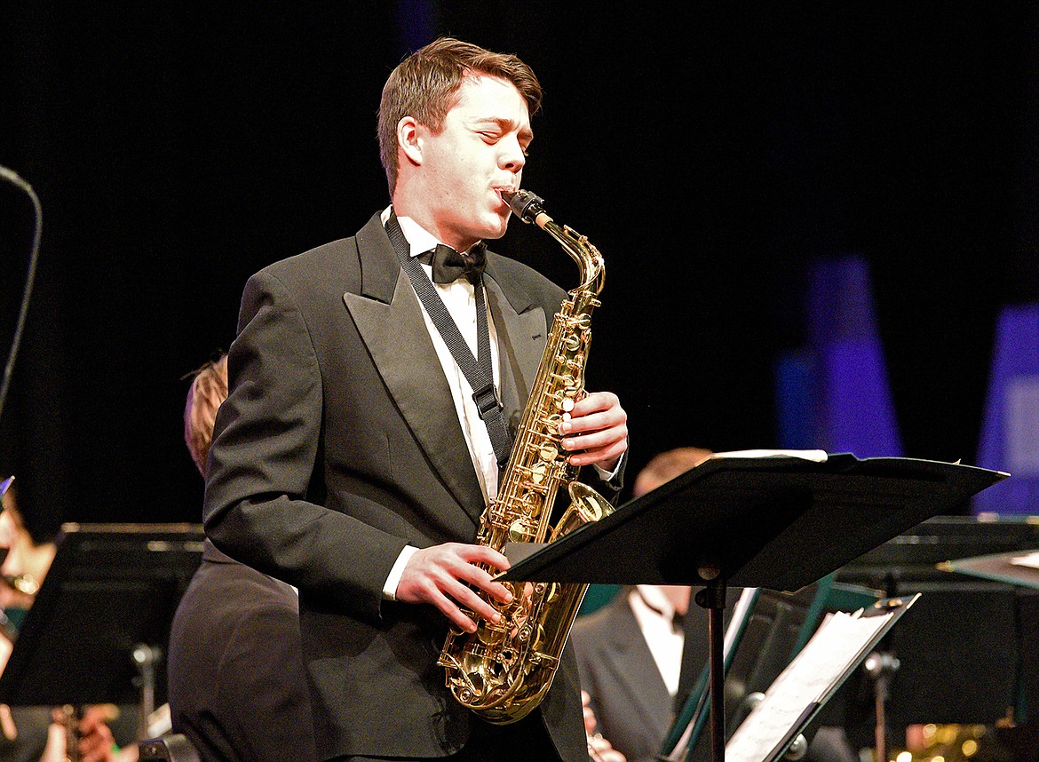 WHS student Henry Seigmund performs a solo on the alto saxophone at the Whitefish High School and Middle School Winter Concert at the Performing Arts Center on Dec. 13. (Whitney England/Whitefish Pilot)