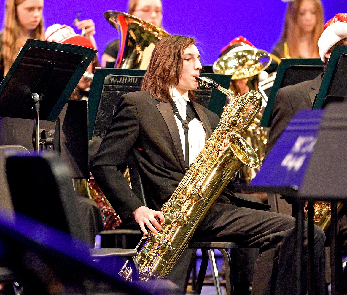 WHS student Michael Weimer performs on the baritone saxophone at the Whitefish High School and Middle School Winter Concert at the Performing Arts Center on Dec. 13. (Whitney England/Whitefish Pilot)