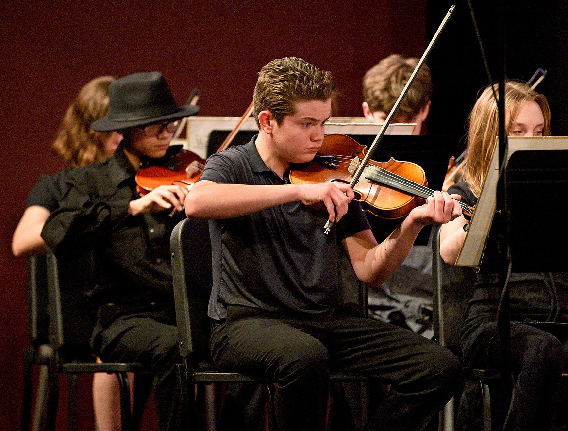 Jessup Hutcheson on the violin perform with classmates at the Whitefish High School and Middle School winter orchestra concert at the Performing Arts Center on Dec. 6. (Whitney England/Whitefish Pilot)