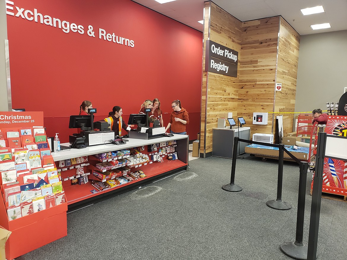 The exchange desk in the Coeur d'Alene Target was fully staffed Dec. 26, but wet weather and rain kept people from returning unwanted Christmas items. Stores had huge after Christmas sales but only sparse crowds for the observed Christmas holiday.