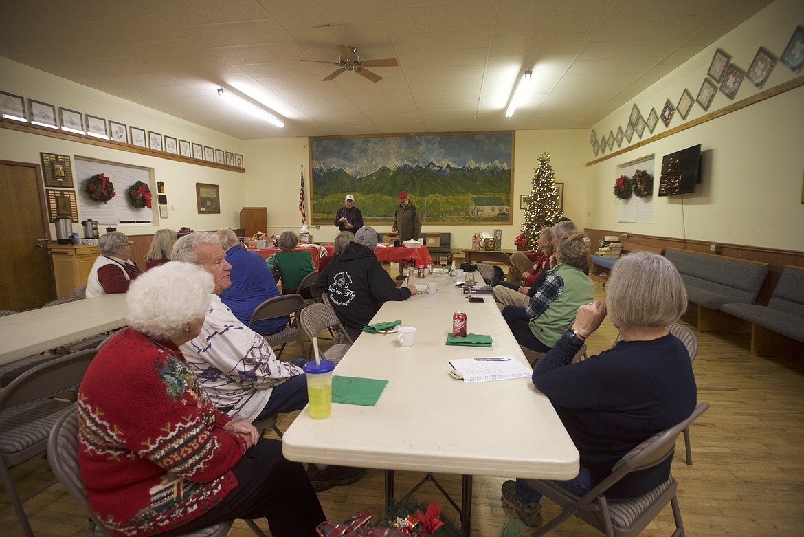 Auctioneers Dave Bunnell and Jim Ploskunak kept the bidding lively during the Leon Club's annual Christmas party at Leon Hall, east of Charlo. (Kristi Niemeyer/Lake County Leader)