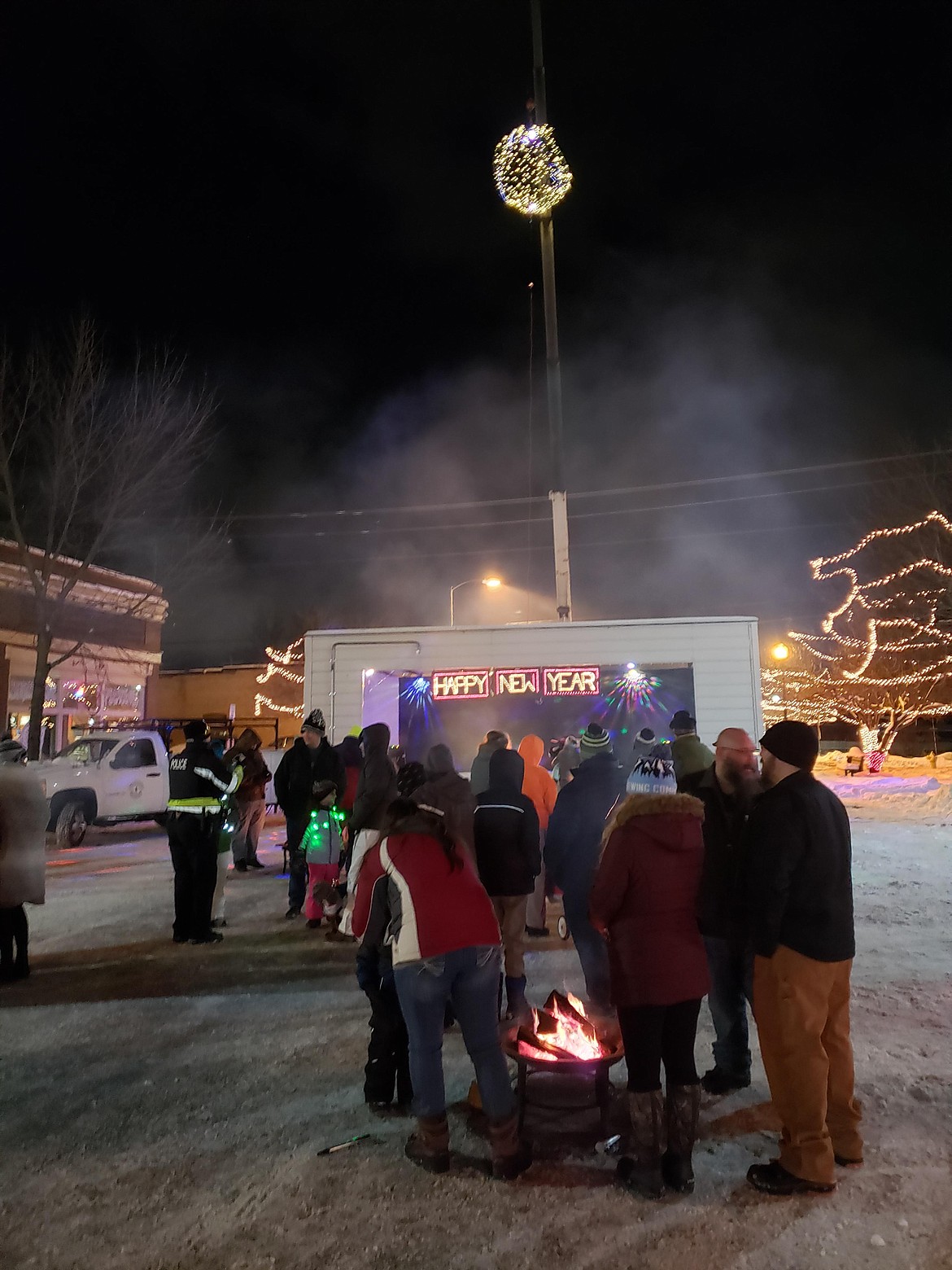 A crowd gathers on Main Street in Rathdrum for a New Year's Eve celebration in 2021. Families celebrate the holiday with a New York Style ball drop from a construction crane. Rathdrum staff provided music, gifts, prizes and fire pits, with an apple cider toast at New York's "midnight."