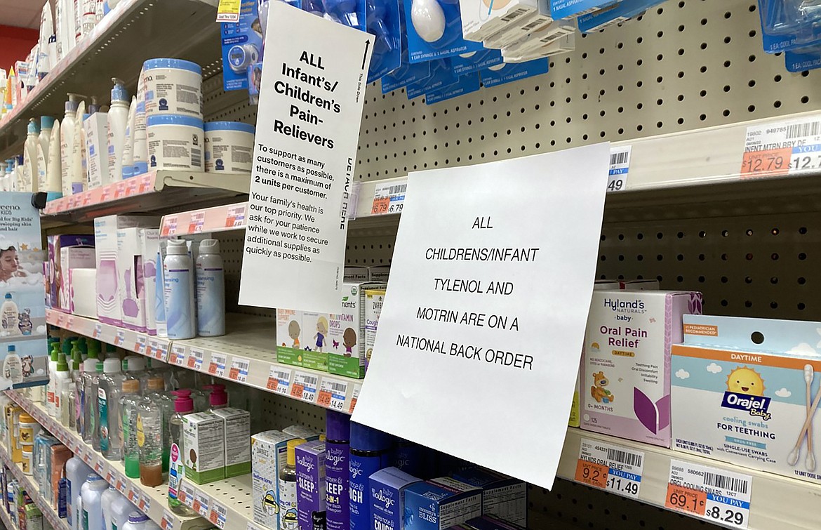 A sign is placed near the section for children's medicine, Sunday, Dec. 18, 2022 at a CVS in Greenlawn, N.Y. Caring for a sick child has become even more stressful than usual for many U.S. parents in recent weeks due to shortages of Children’s Tylenol and other medicines.