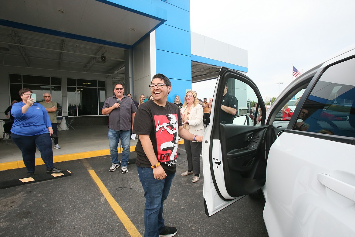 Post Falls High School graduate Malachi Silva reacts to winning a brand new 2022 Chevy Trax during Knudtsen Chevrolet's high school graduate car giveaway and community celebration June 16.