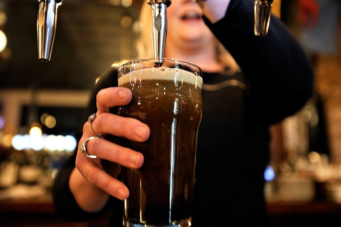 Jennifer Drake pours a Guinness at Crown and Thistle in downtown Coeur d'Alene.