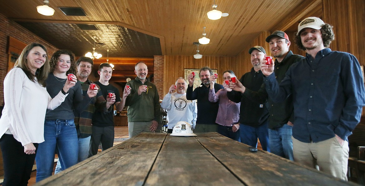 Idaho Strategic Resources employees on March 11 celebrate the company's debut on the New York Stock Exchange. From left: Monique Hayes, Kelly Gallogly, John Swallow, Travis Swallow, Grant Brackebusch, John Etienne, Rob Morgan, Becky Goddard, Thad Samuelson, Andrew Brackebusch and Chandler Harris.