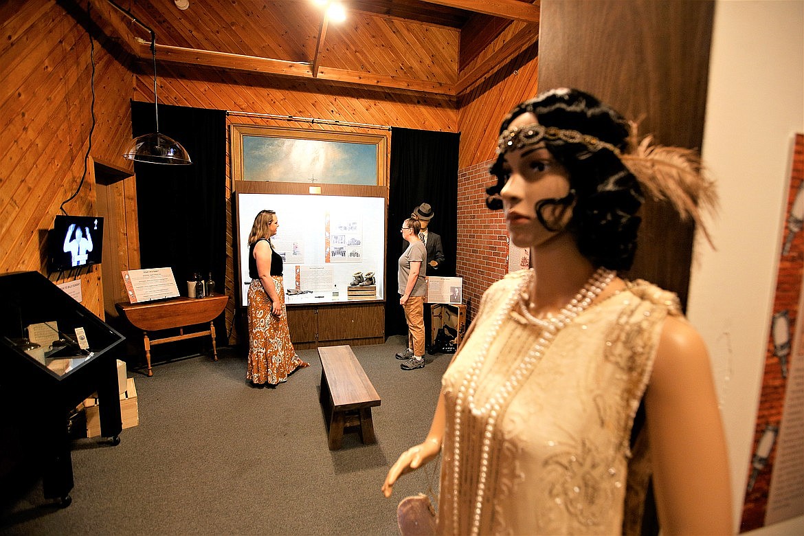 Britt Thurman, left, director of the Museum of North Idaho, chats with Patricia Nedialkova during her June visit to the museum's newest exhibit, “The Rum Rebellion: Prohibition in North Idaho."