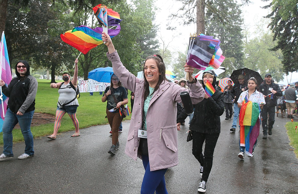 Pride in the Park volunteer Sammy Randazzo leads the Pride Stride on a rainy June morning in Coeur d'Alene City Park.