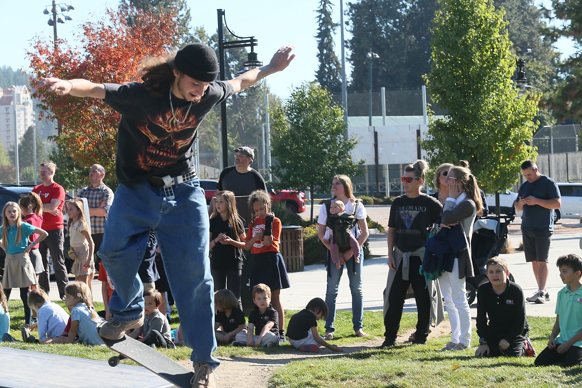 Cameron Day does a skateboard trick Oct. 13 during a demonstration for Sorensen Magnet School of the Arts and Humanities students at the Coeur d'Alene Skate Park.