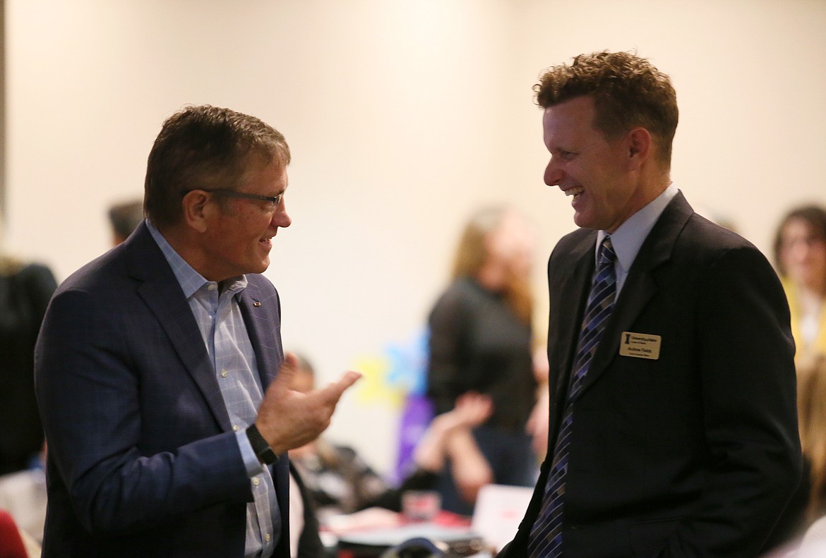 North Idaho College President Nick Swayne, left, and University of Idaho Coeur d'Alene CEO Andrew Fields, visit before speaking Sept. 20 at the Post Falls Chamber of Commerce's Connect4Lunch event in Red Lion Templin's on the River.