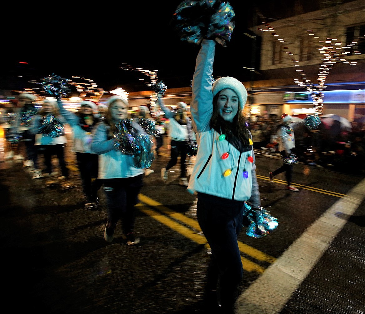 Lake City High School cheerleaders join Coeur d'Alene's Christmas parade.