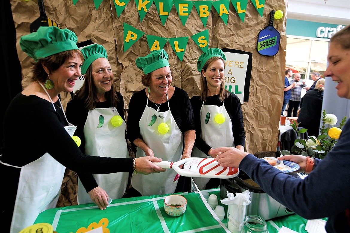 The Pickleball Pals, from left, Carol Wegleitner, Carla Redline, Linda Mitchell and Rochelle Wineinger, have fun while serving up Sour Pickle Soup during Souport the End of Homelessness in November at the Silver Lake Mall.