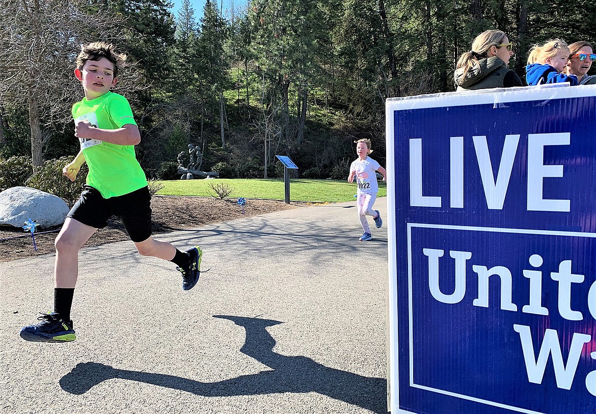 Isaac Pelphrey charges to the finish line of the Tot Trot, which was part of the 40th annual Spring Dash activities at McEuen Park.