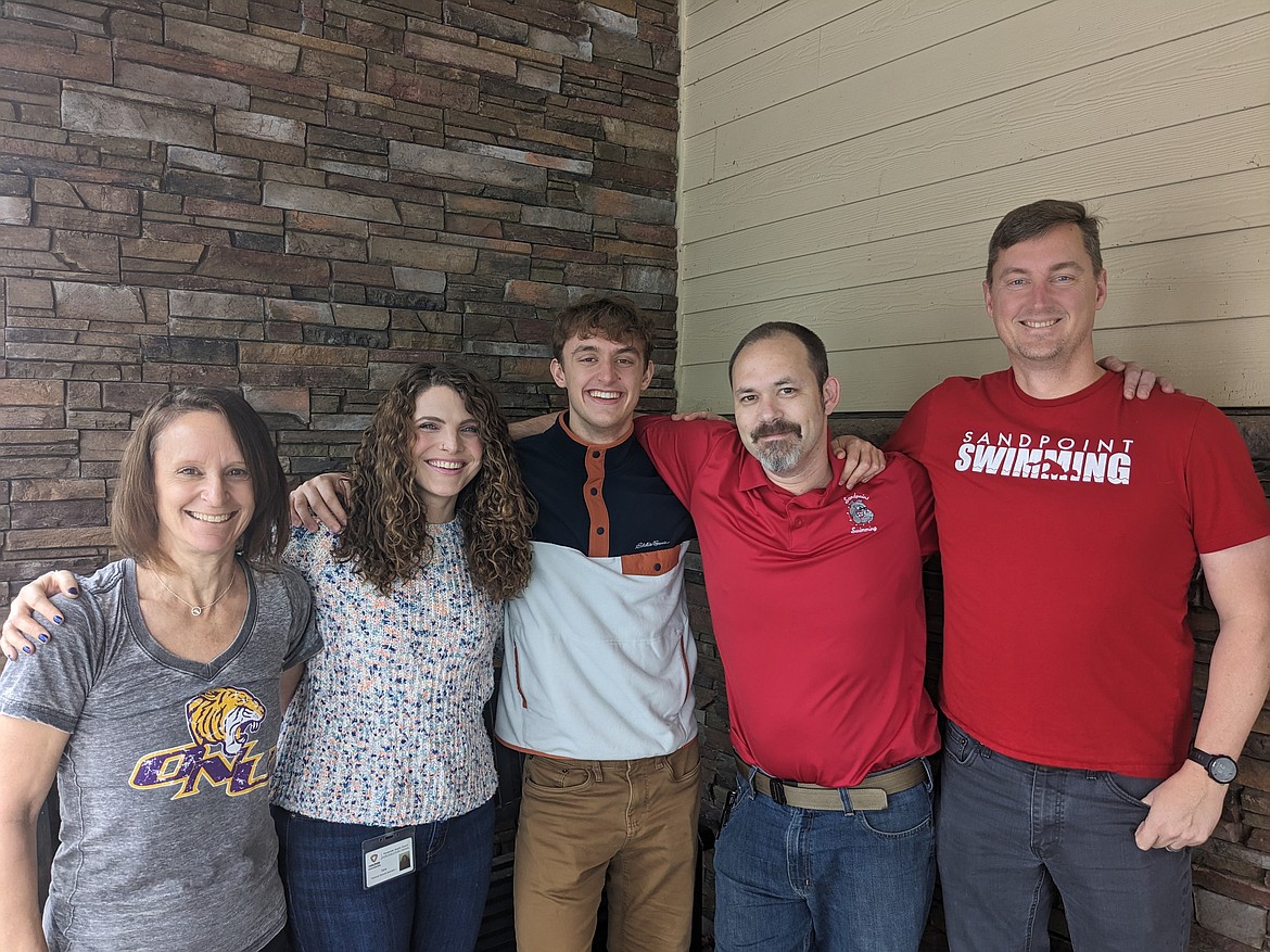 Caleb, his family, and coaches celebrate his recent commitment to Olivet Nazarene University for swimming and academics. Pictured from left to right: Anne Marie Norling, Coach Sara Zwink, Caleb Norling, coach Greg Jackson, and Aaron Norling.