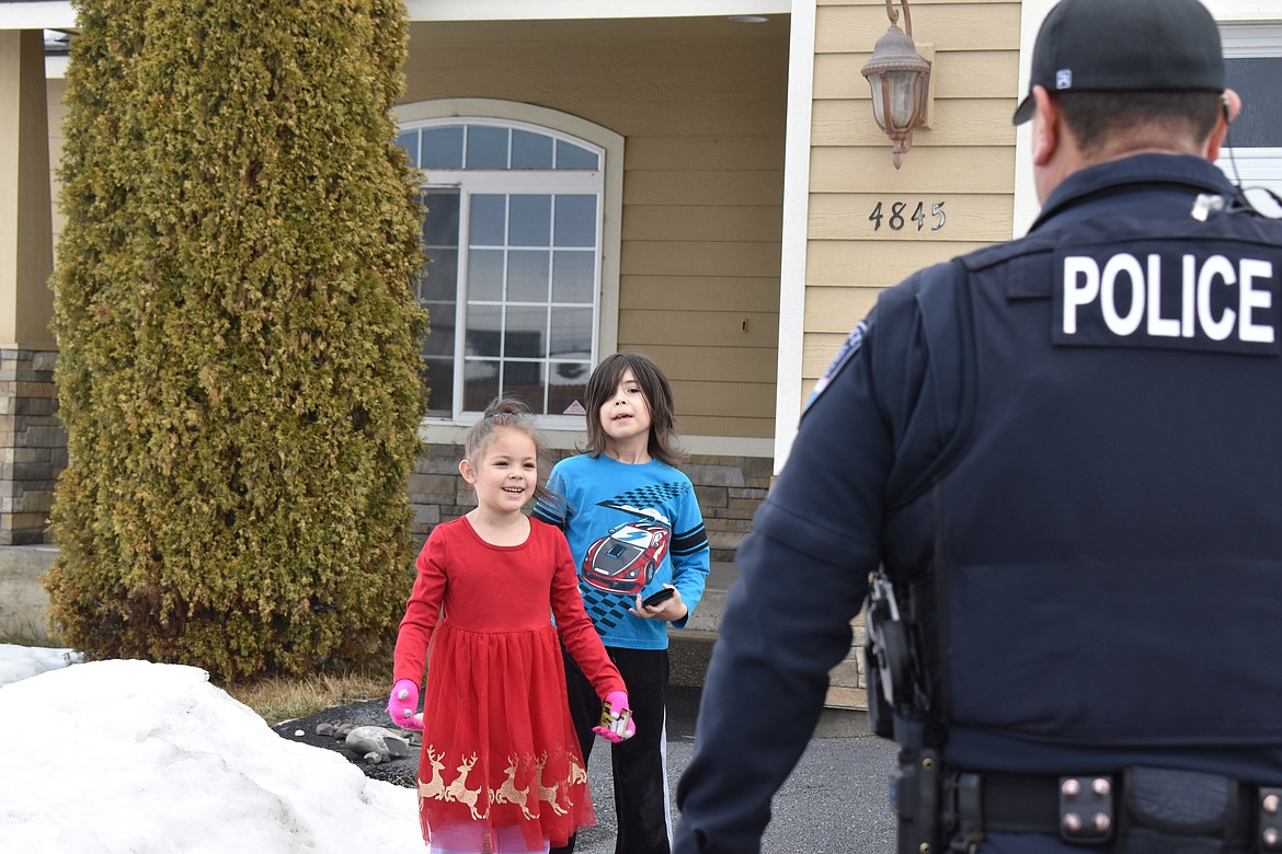 Amelia Snyder, left, was excited when Moses Lake Police officers showed up at her home to thank her for her kind notes and cookies the week before. Amelia’s brother Zachary wasn’t far behind.