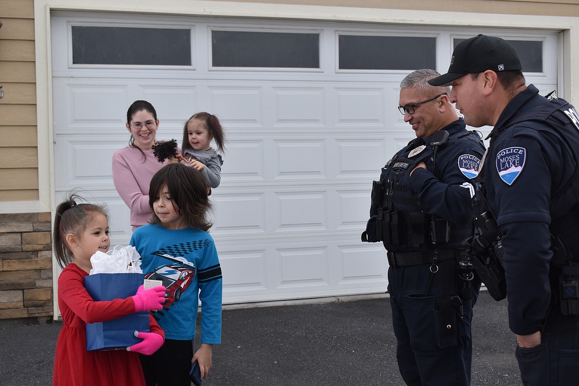 MLPD officers Ray Lopez and Joaquin Espinoza brought Amelia a gift for her kindness.