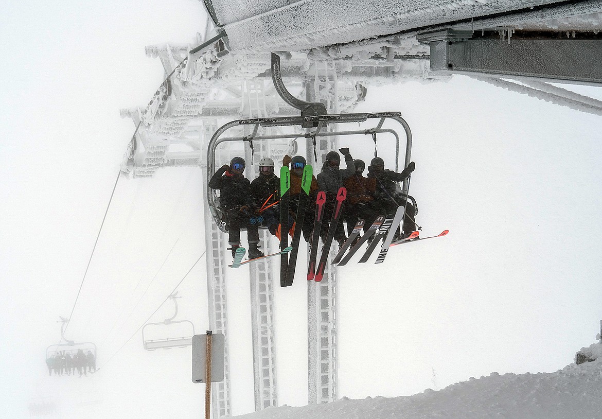 Whitefish Mountain Resort's new Chair 4, Snow Ghost Express, delivers a group of skiers to Inspiration Ridge on Dec. 30, the lift's grand opening. (Photo courtesy of Whitefish Mountain Resort.)