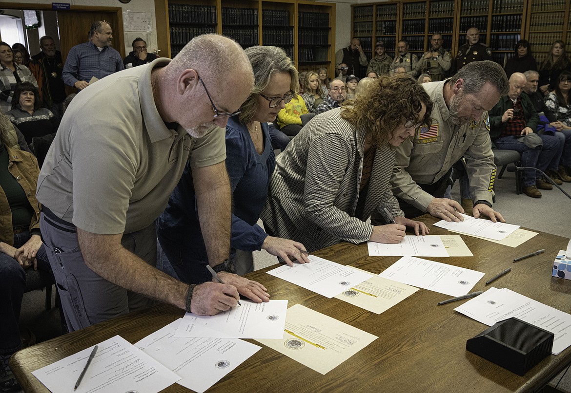 Pat Barber, Nichol Scribner, Naomi Leisz and Shawn Fielders at a swearing-in ceremony at the Sanders County Courthouse. (Tracy Scott/Valley Press)