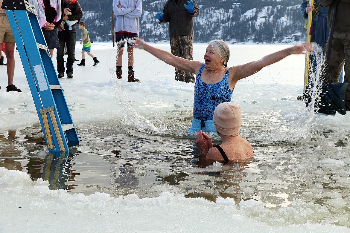 A pair of Polar Bear Plunge participants have fun in the water after taking part in the New Year's Day tradition.