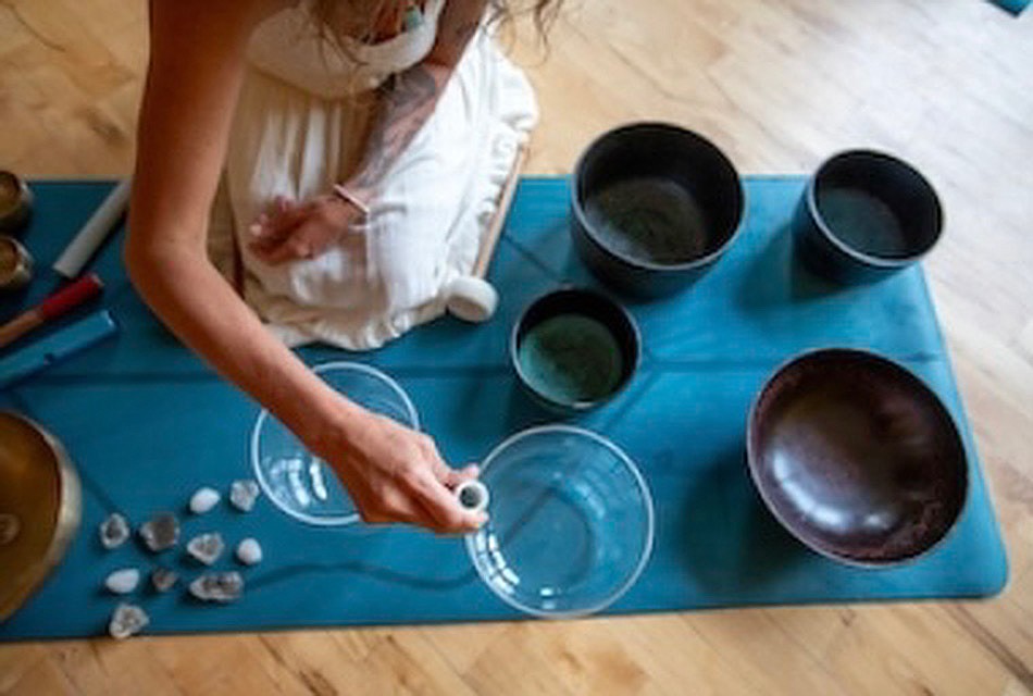 A photo of crystal sound bath being taught at The Yellow Room