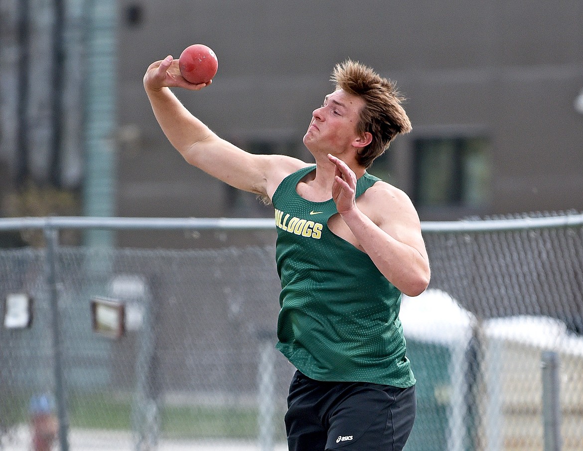 Whitefish senior Talon Holmquist unleashes a massive shot put throw at the Whitefish Triangular meet. (Whitney England/Whitefish Pilot)