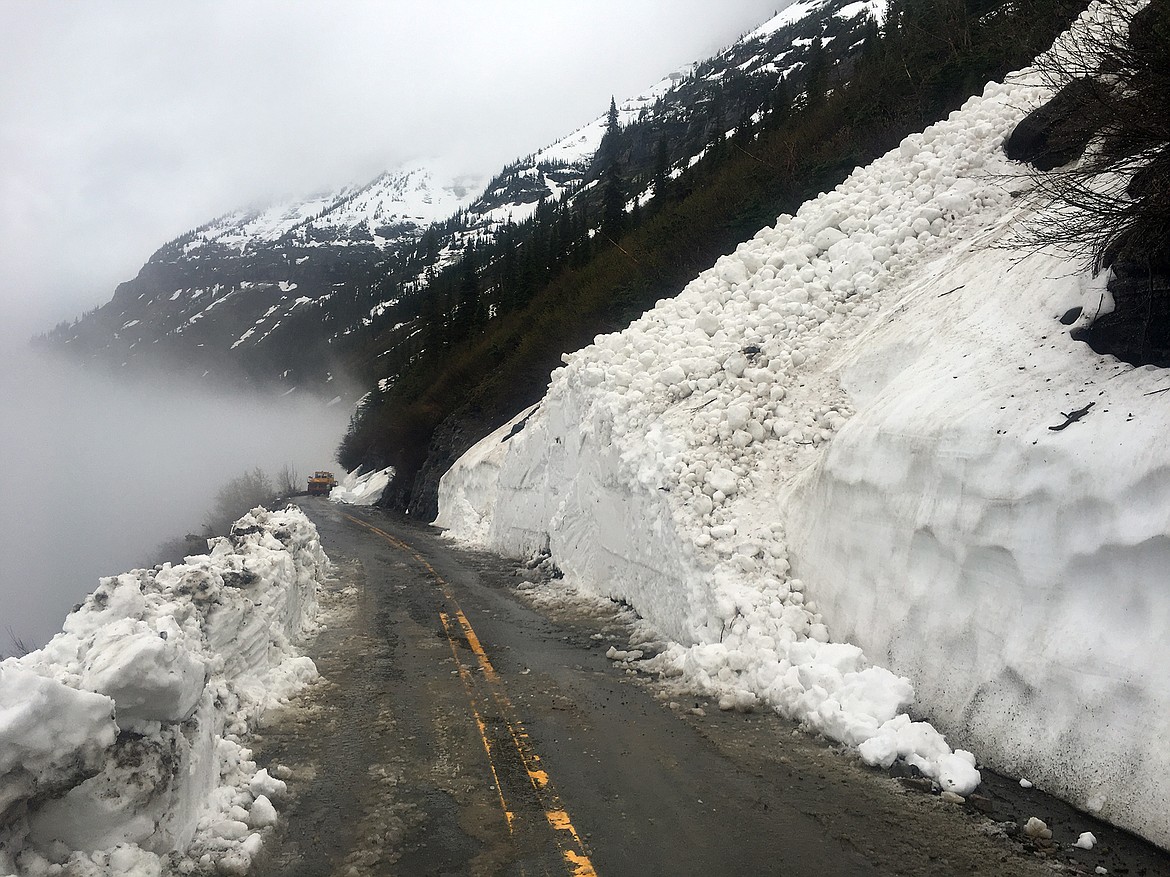 Glacier National Park Road Crew clears avalanche debris in the upper reaches of the Sun Road on June 21 after a long weekend of spring storms. (Photo courtesy of U.S. Geological Survey and Glacier National Park)