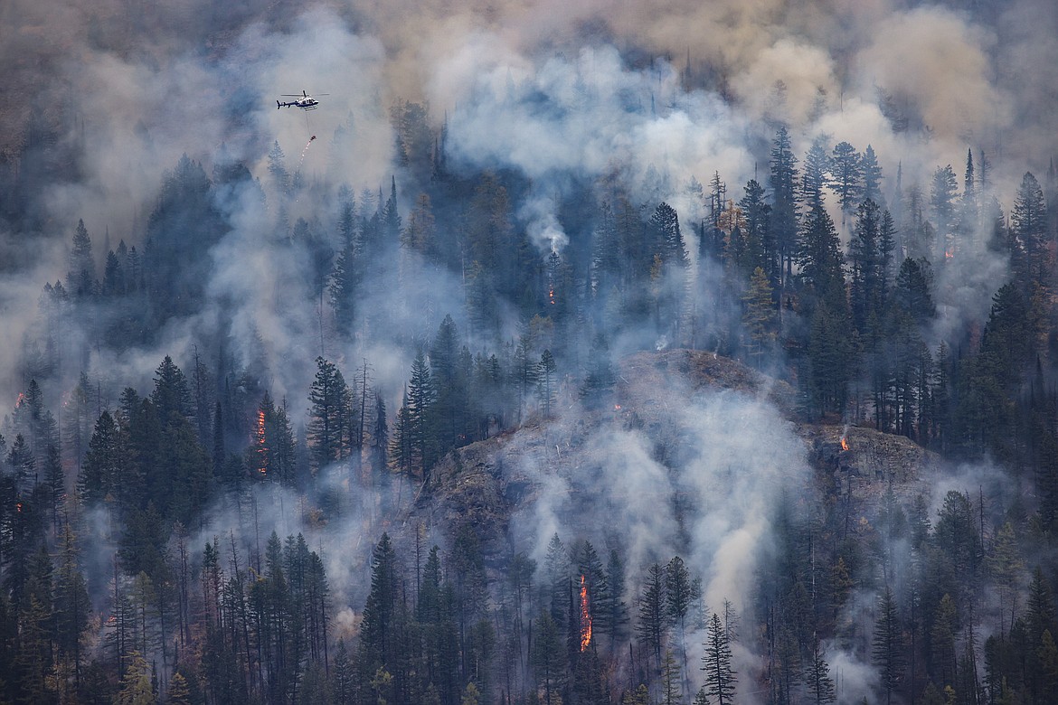 A Forest Service helicopter drops Flash 21 on a controlled burn on Big Mountain. (JP Edge photo)