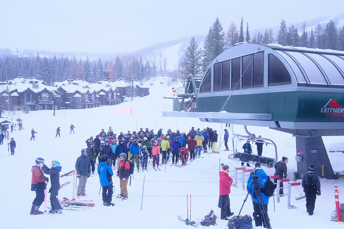 Skiers wait in line for the first rides up the Snow Ghost Express at Whitefish Mountain Resort on Friday, December 30, 2022. (Adrian Knowler/Daily Inter Lake)