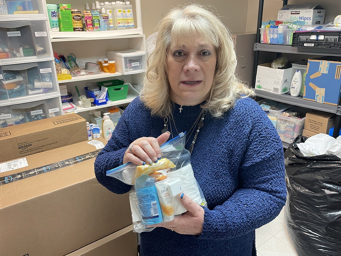 Serve Moses Lake volunteer Sheryl Ulnick shows off one of the hygiene kits – contained in a 1-gallon resealable plastic bag – donated to the organization on Tuesday.