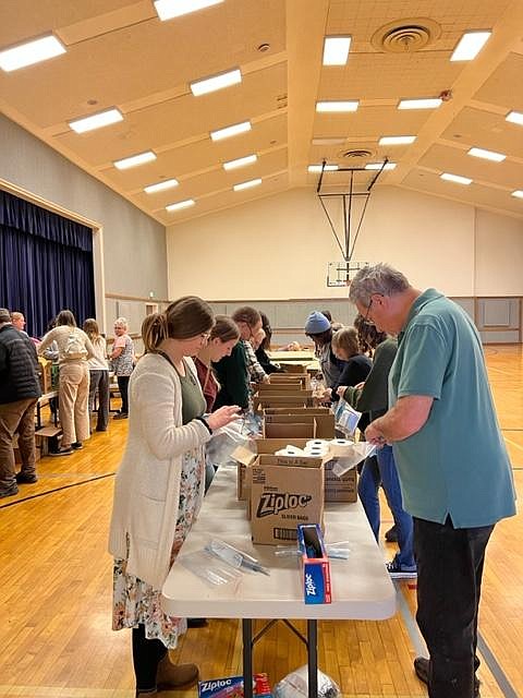 Volunteers at the Church of Jesus Christ of Latter-day Saints’ Moses Lake Stake assemble hygiene kits in late December.