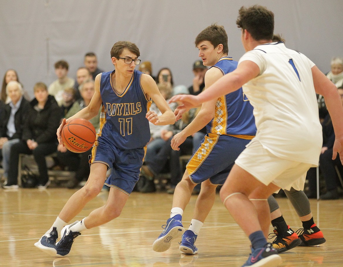 MARK NELKE/Press
Carson Malinauskas (11) of North Idaho Christian School drives to the basket against Christian Center School on Tuesday night at The Courts at Real Life in Post Falls.