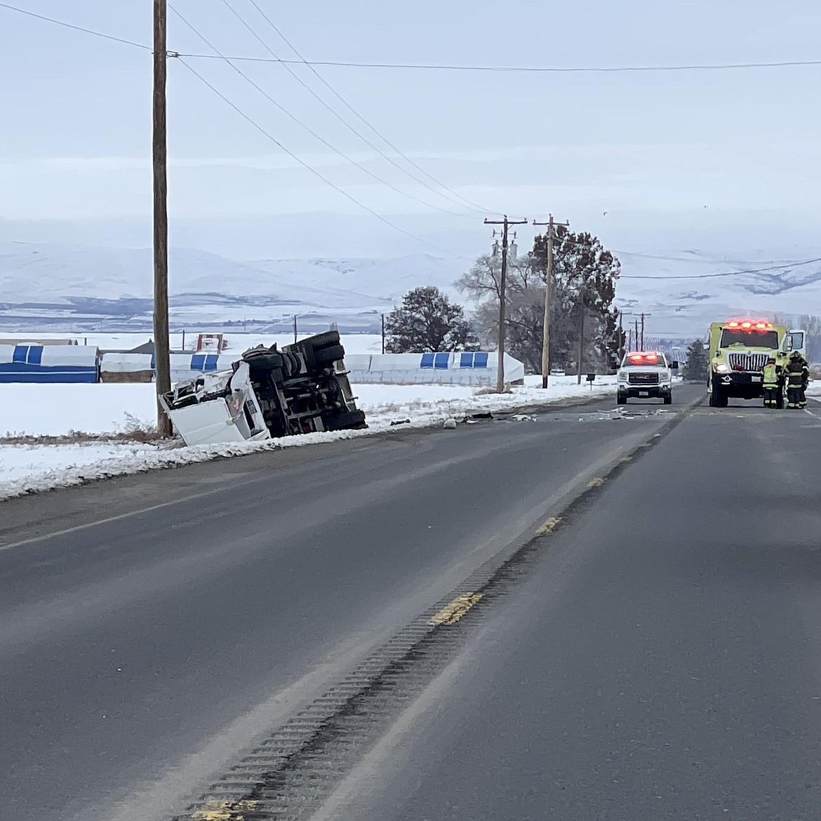 A propane truck flipped over Wednesday on a stretch of Adams Road between Road 5 NW and Road 6 NW south of Quincy.