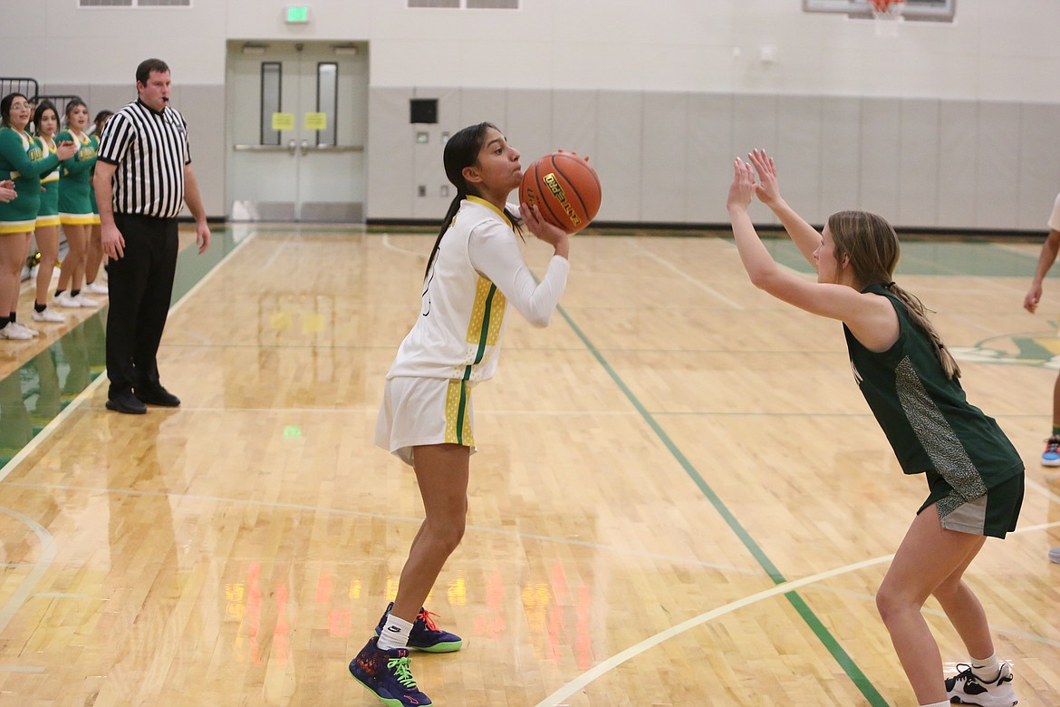 Quincy freshman Chloe Medina, pictured shooting a three-pointer, finished with a team-high 17 points against Chelan on Tuesday.