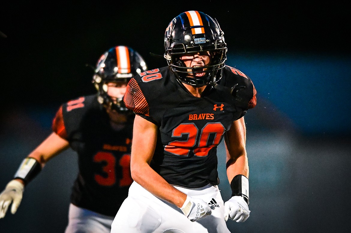 Flathead defensive back Trevor Burke (20) celebrates after causing a fumble recovered by teammate Connor Skalsky in the fourth quarter against Billings Skyview at Legends Stadium on Friday, Aug. 26. (Casey Kreider/Daily Inter Lake)