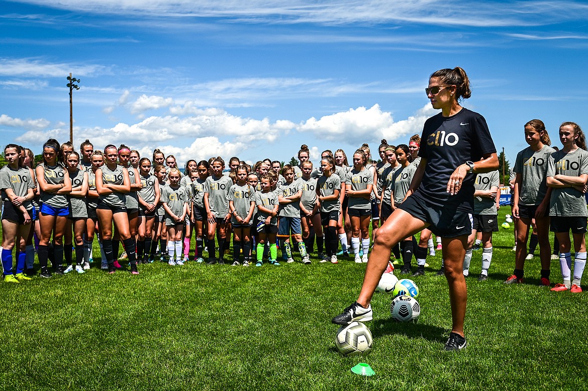 Carli Lloyd describes a drill to attendees of her CL10 Soccer Clinic at Flip Darling Memorial Field at Columbia Falls High School on Saturday, July 2. Lloyd is a former American professional soccer player; a two-time Olympic gold medalist; two-time FIFA Women's World Cup champion; two-time FIFA Player of the Year and a four-time Olympian. (Casey Kreider/Daily Inter Lake)