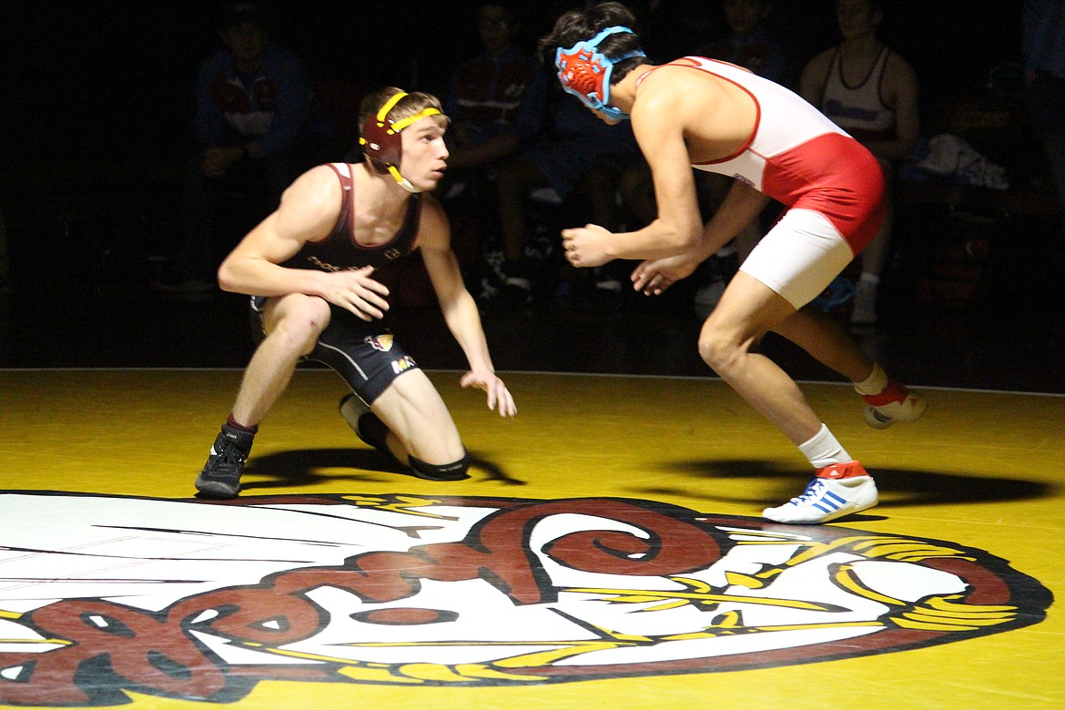 Joshua Grubb, left, of Moses Lake faces off against Zander Mora of West Valley (Yakima) in Wednesday’s dual meet.