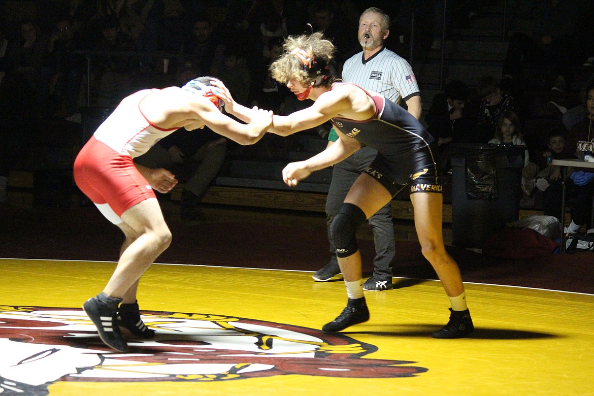 Dayton Regan, right, Moses Lake, takes the measure of his opponent Tyler Vigansky in Moses Lake’s dual meet against West Valley (Yakima) Wednesday.