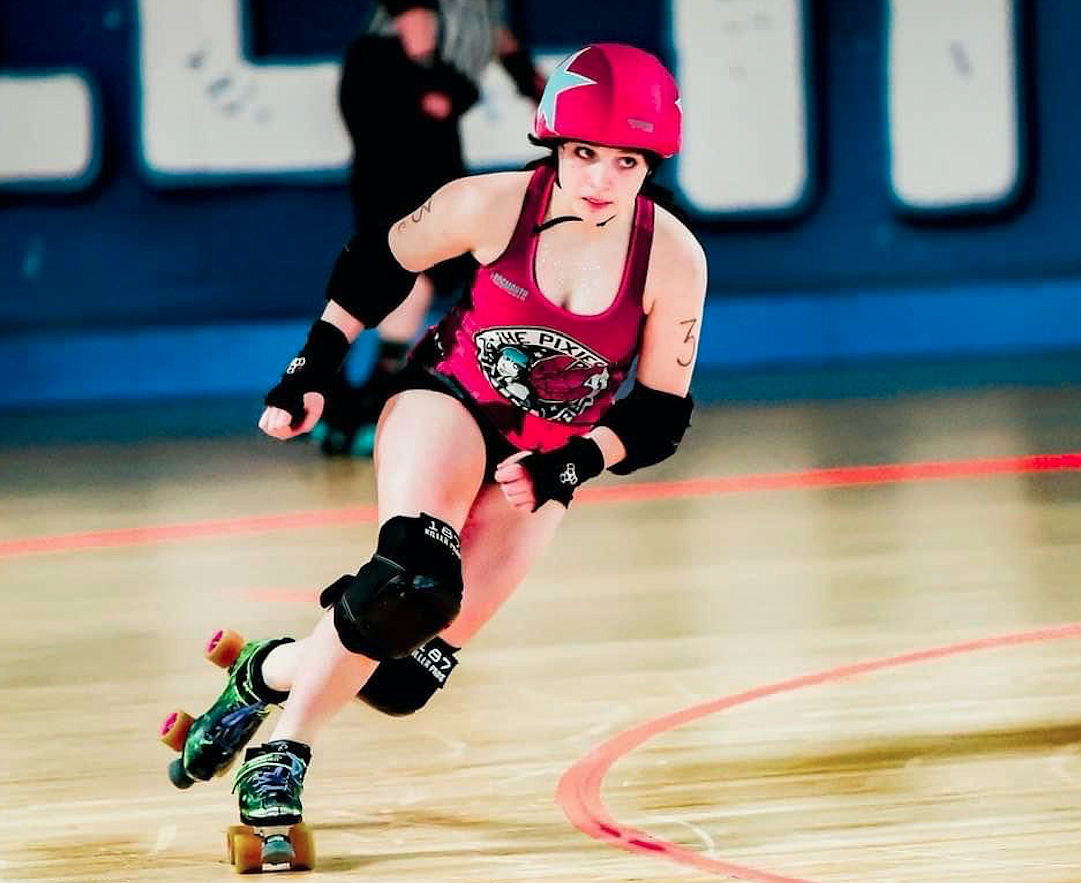 Pixies Roller Derby Capt. Gracie Goodnature, a Lake City High sophomore, sails across the skating rink during a bout in May 2022. She and a teammate from Spokane Valley have been selected to compete with Team USA in the 2023 Junior Roller Derby World Cup in July in France.
