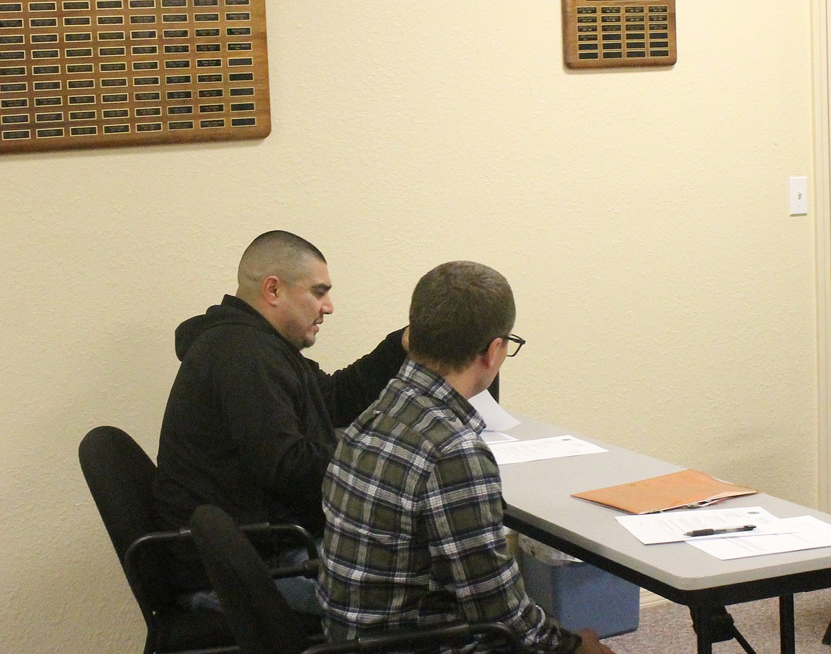 Royal City Police Chief Rey Rodriguez, left, addresses the city council Tuesday evening flanked by Finance Director Shilo Christensen.